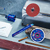A blue Bosch Professional tool set is lying on a work surface.