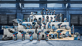 Various Bosch Professional tools in blue on white pedestals.