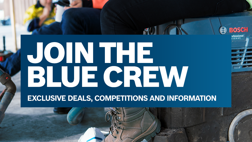 Bosch Professional tool on a table, worker with boots next to it.