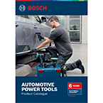 A man in work clothes is using professional Bosch tools on a vehicle in a workshop.