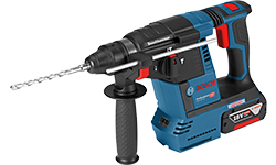 A blue Bosch Professional cordless drill with SDS-Plus drill bit.