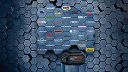 A Bosch Professional toolbox in front of a hexagonal wall with logos.