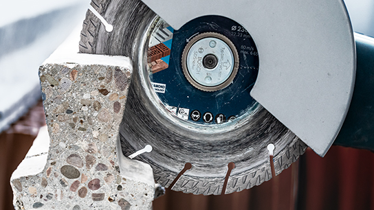 A Bosch Professional cutting disc cuts into a concrete block.