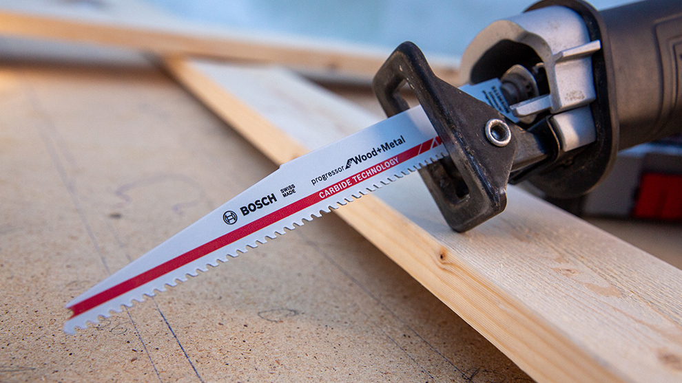 A Bosch Professional saw blade is lying on wooden boards.