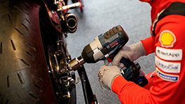 Ducati Impact Wrench A mechanic in a red shirt is using a Bosch Professional impact wrench.