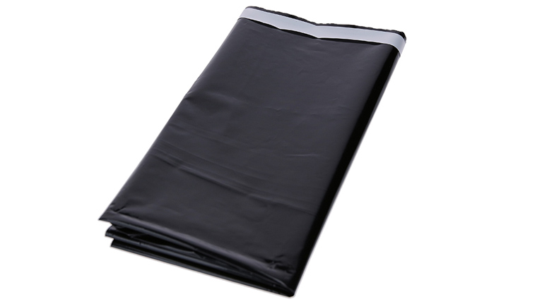 Black plastic bag with silver closure edge, folded on white background.