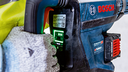 Bosch Professional cordless tool with green light and handle.