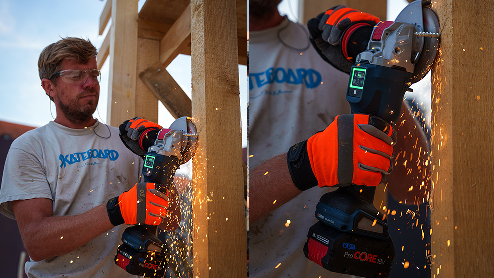 A man is cutting wood with a Bosch Professional cordless saw, sparks are flying.