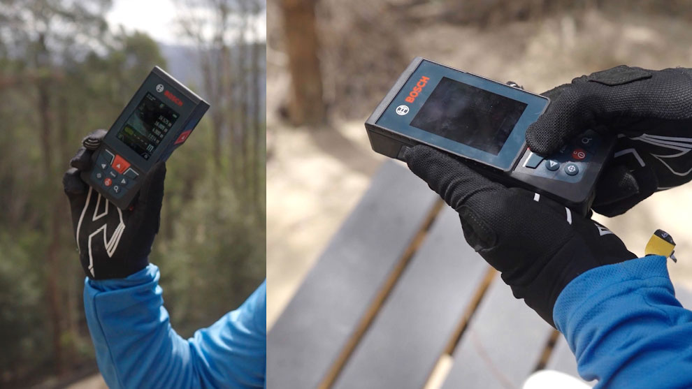 RAMPED-UP PRECISION A Bosch Professional distance measurer is held outdoors.