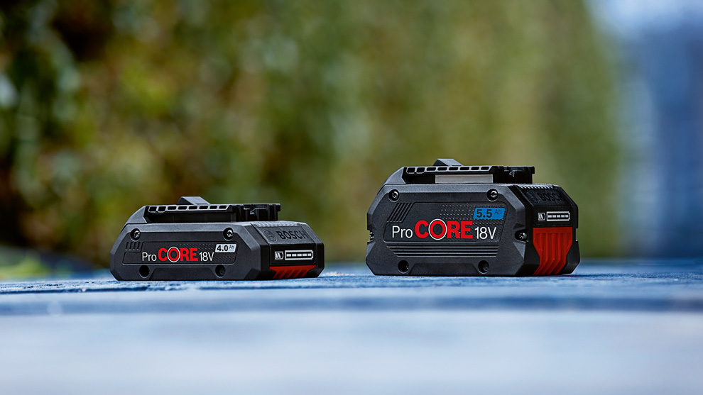 Two Bosch ProCORE 18V batteries, black with red accents, on a blue background.